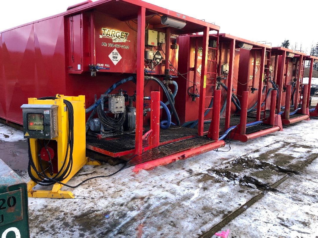 Burto heater connected to a row of red fluid storage tanks